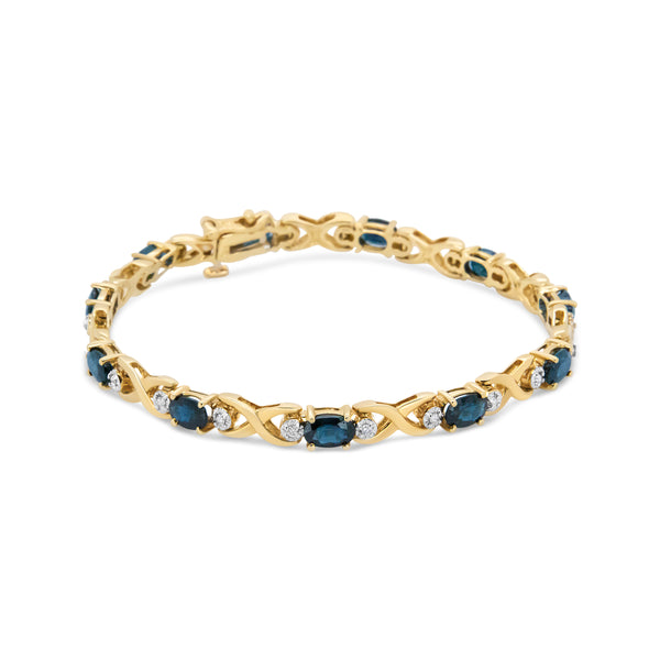 14K Yellow Gold 1 1/4 Cttw Round Diamond and 6x4mm Blue Sapphire "X" Link Bracelet (I-J Color, I1-I2 Clarity)- Size 7"