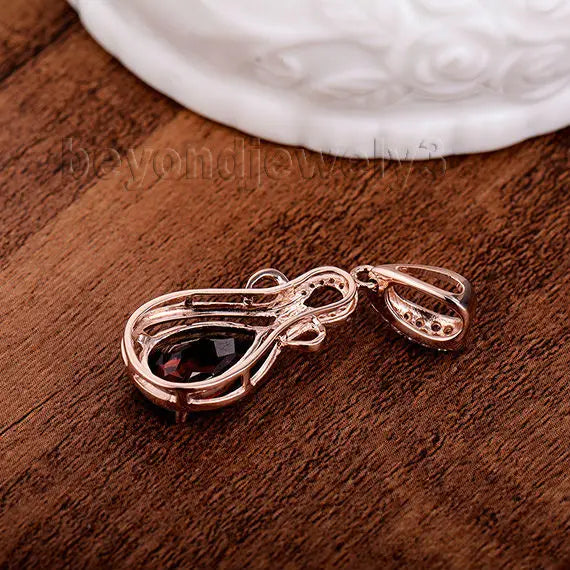 14K Rose Gold Garnet Pendant.