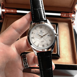 Luxury Men's Waterproof Diamond Date Leather Watch with Quartz Movement and Stainless Steel band.