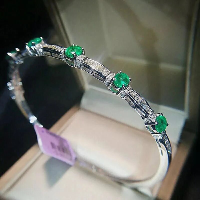 Sterling Silver Emerald Bracelet with Designer Charms. for Women