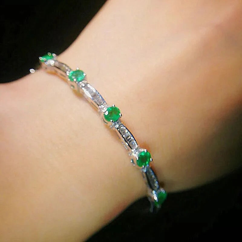 Sterling Silver Emerald Bracelet with Designer Charms. for Women