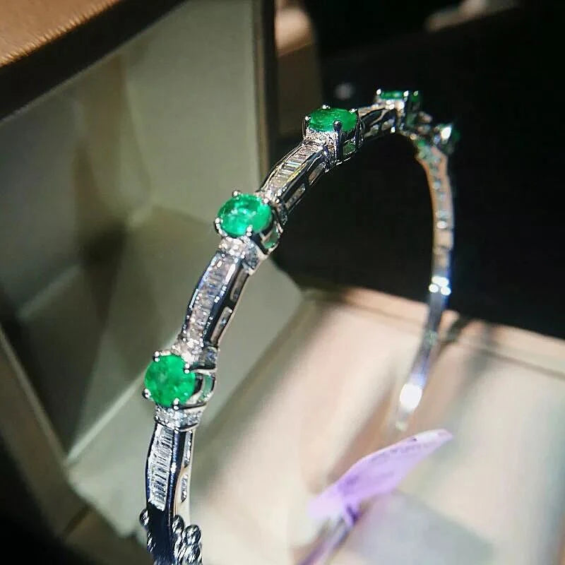 Sterling Silver Emerald Bracelet with Designer Charms. for Women