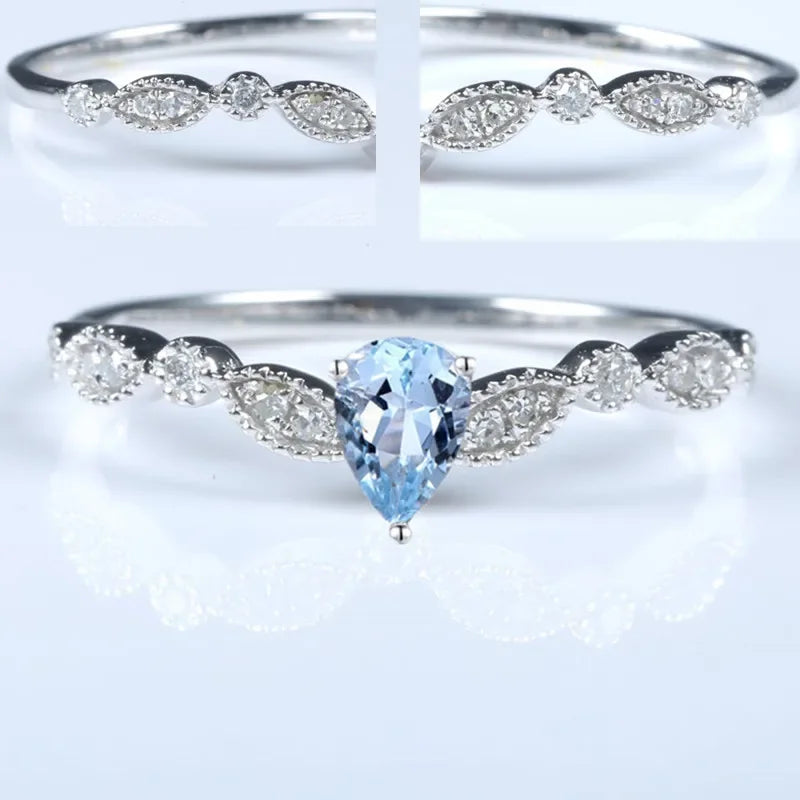 14k White Gold Pear Blue Topaz Diamond Ring