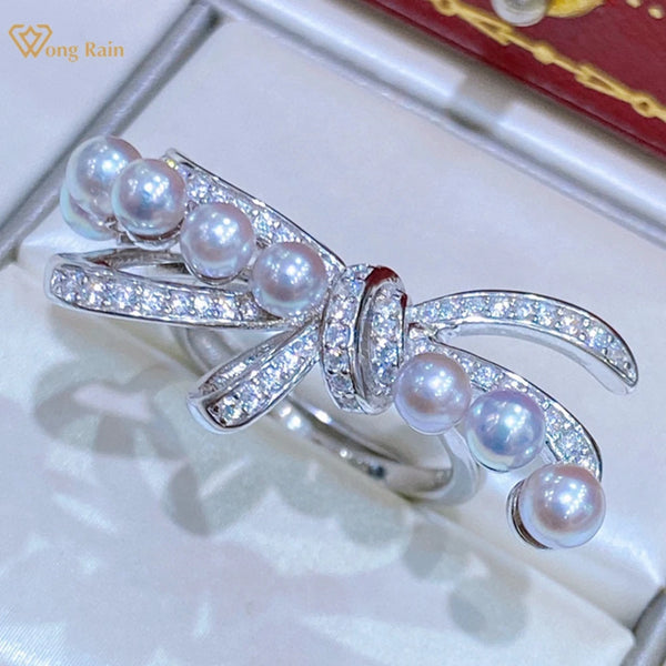 Wong Rain 925 Sterling Silver 4-5 MM Natural Pearl High Carbon Diamond Gems Adjustable Bowknot Ring for Women Customized Jewelry