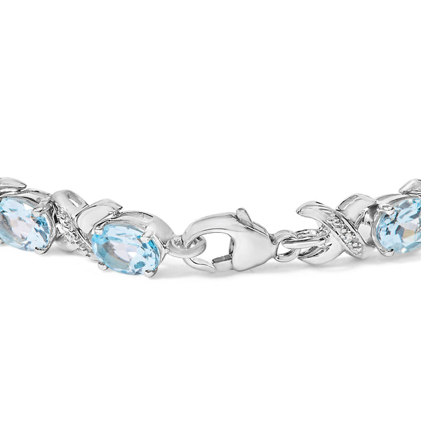 .925 Sterling Silver 16.0 Cttw Oval Blue Topaz and Diamond Accent Tennis X Link Bracelet (I-J Color, I1-I2 Clarity) - Size 7" Inch