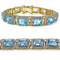 14K Yellow Gold Plated 24.05 Carat Genuine Blue Topaz .925 Sterling Silver Bracelet