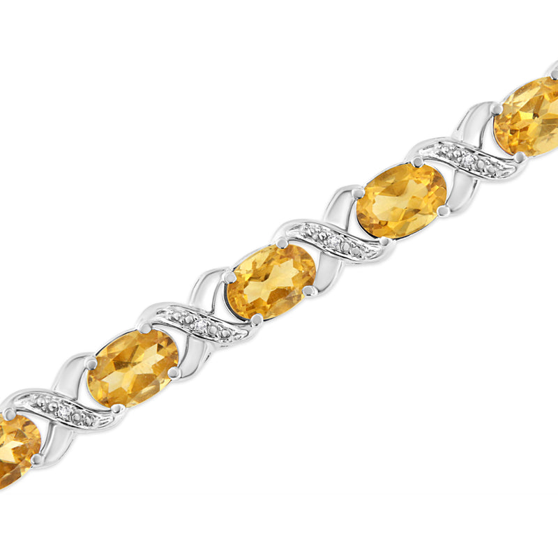 .925 Sterling Silver 7x5 mm Oval Cut Orange Citrine and 1/20 cttw Round Cut Diamond Fashion Tennis Bracelet (I-J Color, I1-I2 Clarity) - 7"