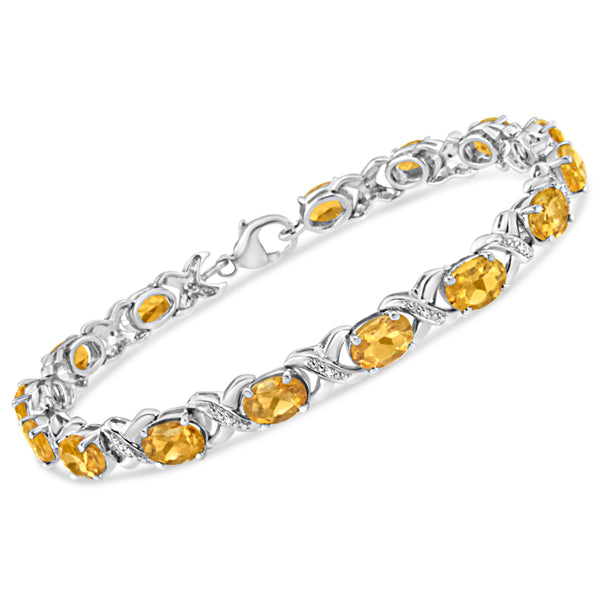 .925 Sterling Silver 7x5 mm Oval Cut Orange Citrine and 1/20 cttw Round Cut Diamond Fashion Tennis Bracelet (I-J Color, I1-I2 Clarity) - 7"