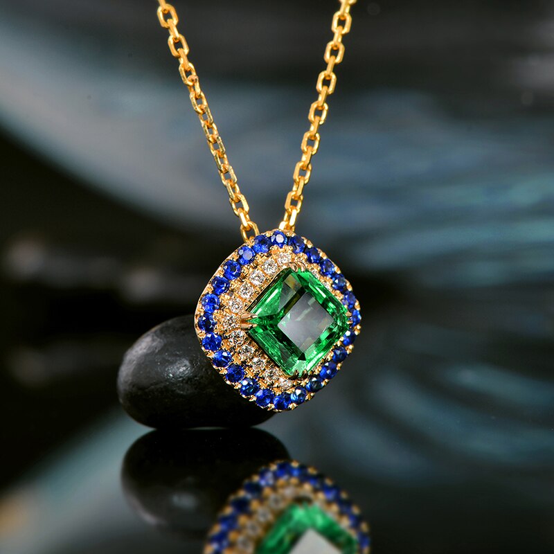 14kt Yellow Gold Emerald Pendant with Diamonds and Sapphire Accents for Women