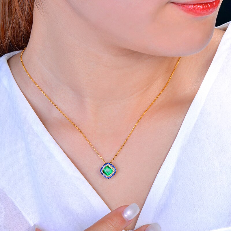 14kt Yellow Gold Emerald Pendant with Diamonds and Sapphire Accents for Women