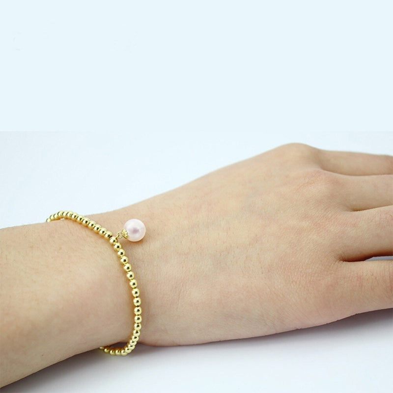Golden Pearl Beaded Strand Bracelet - Adjustable and Elegant