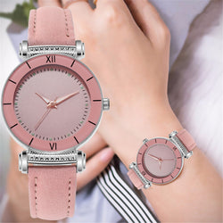 Stainless steel quartz watch with leather strap for women.
