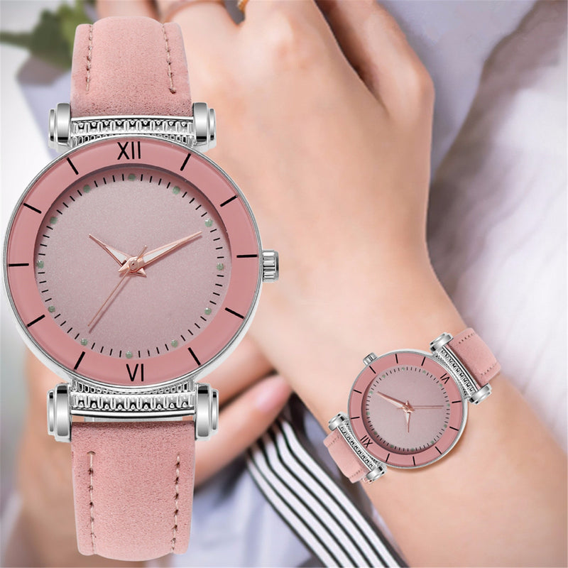 Stainless steel quartz watch with leather strap for women.